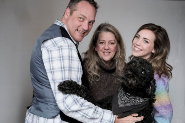 John, Bernadette and Charlie Fynn the dog. ( who has met more than 100 dogs in the past 2 months)